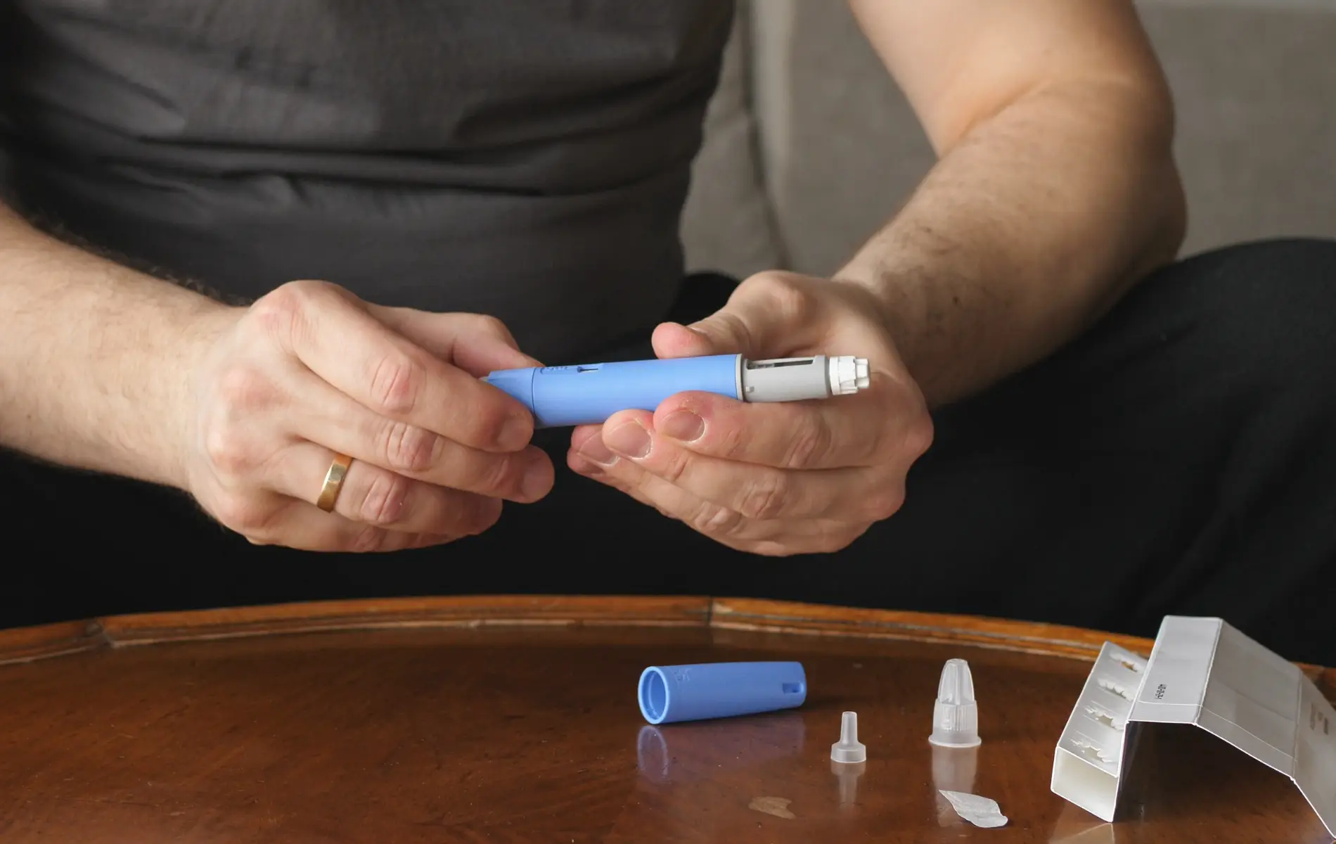 person holding a semaglutide pen